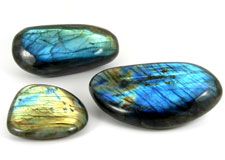 Polished and natural crystals, spheres, freeforms and pebbles of  Labradorite