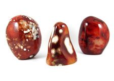 Polished and natural crystals, spheres, freeforms and pebbles of  Carnelian